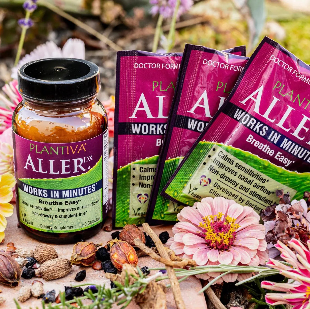 Plantiva Aller Dx supplement bottle and packets with flowers and other botanicals