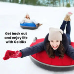 Person snow tubing in the snow with promotional text for ColdDX.