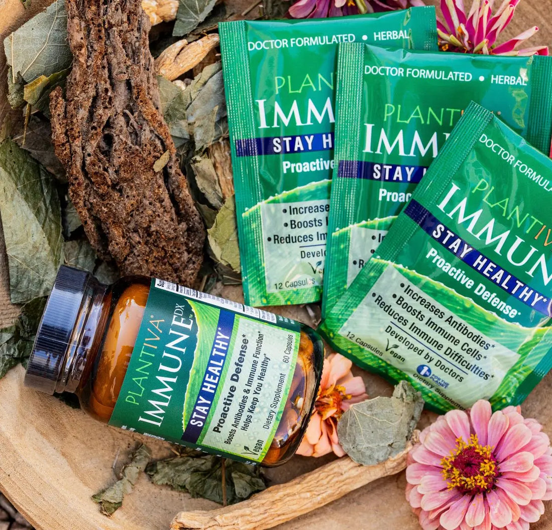 One bottle and 3 packets of ImmuneDx with flowers and other botanicals
