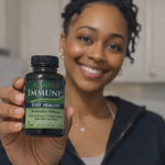 Woman holding a bottle of Plantiva Immune supplement in a kitchen setting
