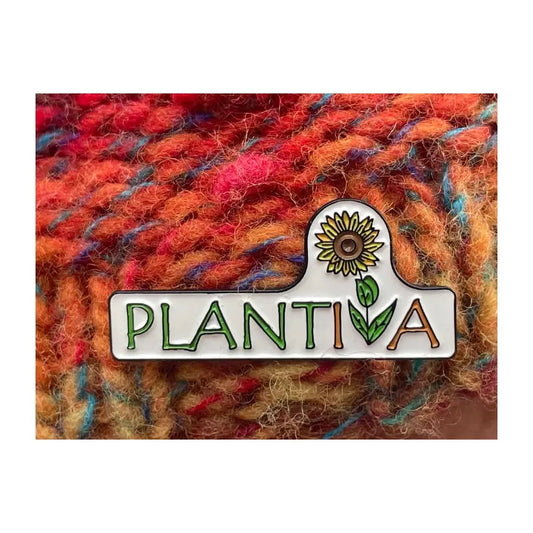 A hatpin with the Plantiva logo